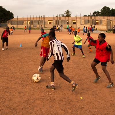 A Projects Abroad volunteer work with teens to teach football in Ghana. A sports player gains experience through volunteer football coaching in Ghana.